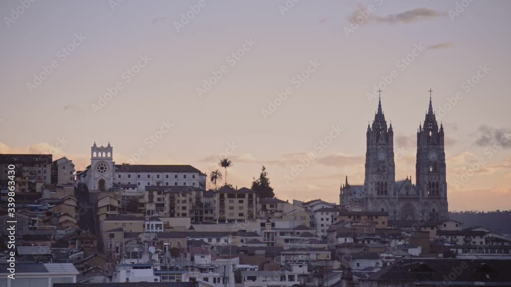 Landscape city and Basilica del Voto Nacional view, Quito, Ecuador, at sunset Landscape city and Basilica del Voto Nacional view, Quito, Ecuador, at sunset