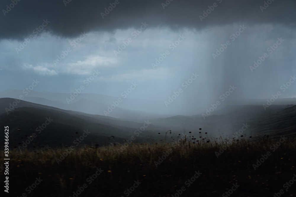Wonderful view of the rain clouds over the mountains. Wonderful view of the rain clouds over the mountains.