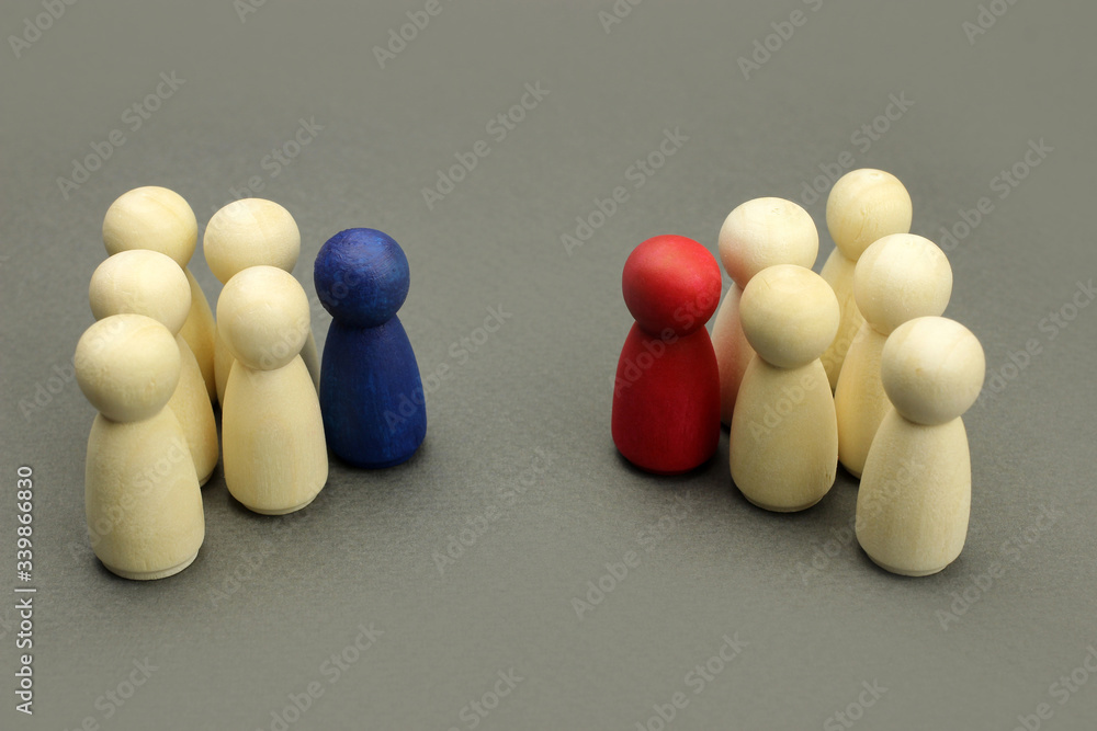 Wooden figures of people. Two business teams with leaders, business concept Wooden figures of people. Two business teams with leaders, business concept