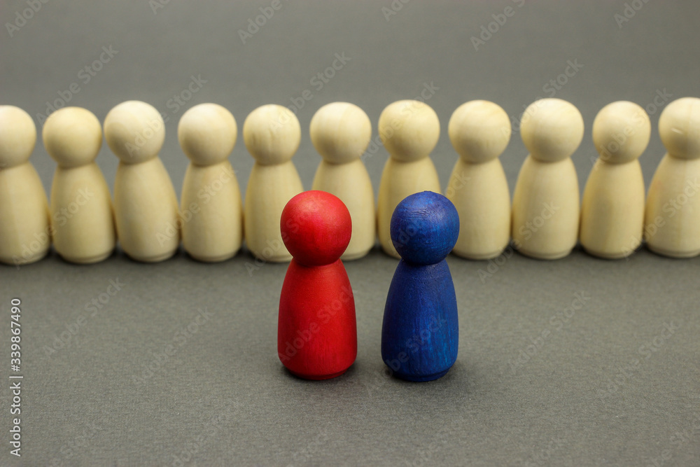 Wooden figures of people. Two leaders in front of the team, business concept Wooden figures of people. Two leaders in front of the team, business concept