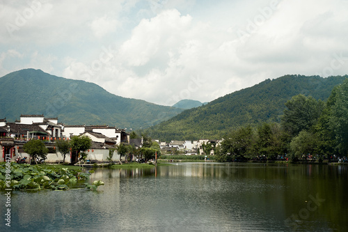 Landscape view with ancient village, mountains and river 