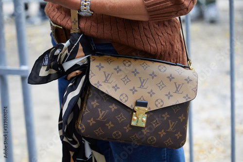 Woman with Louis Vuitton bag and Chanel scarf on September 19