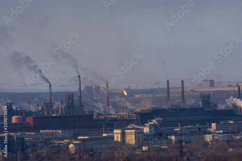 Magnitogorsk. Chelyabinsk province. Russia. March 05, 2020: Magnitogorsk Metallurgical Plant view. Plant with pipes and smoke. Panorama of magnitogorsk industrial complex. Emissions of air pollution