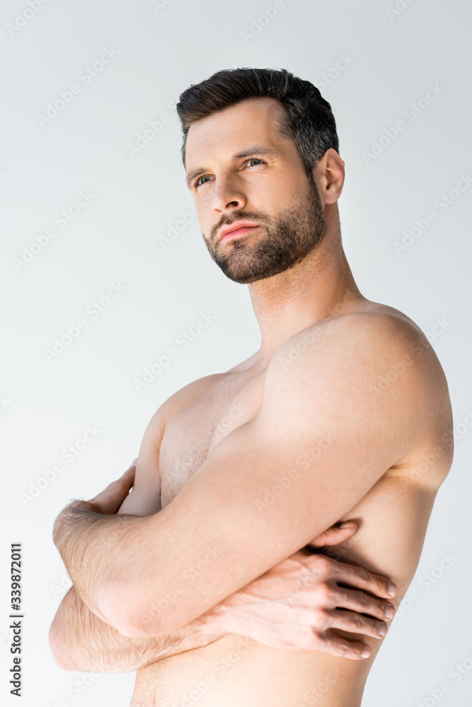 handsome and shirtless man with crossed arms isolated on white handsome and shirtless man with crossed arms isolated on white