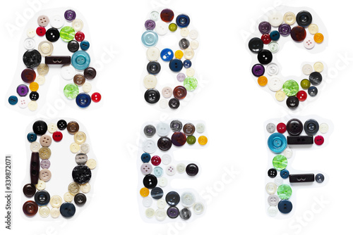 Buttons from clothes in the form of letters of the English alphabet