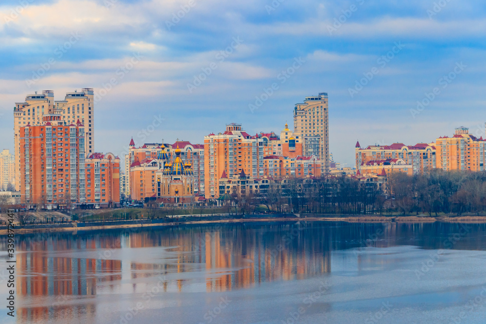 View of Obolon embankment of the Dnieper river and church of the Nativity of Christ in Kiev, Ukraine