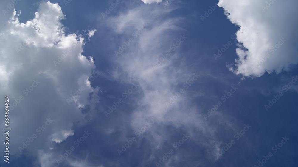 fluffy white clouds in the blue sky fluffy white clouds in the blue sky
