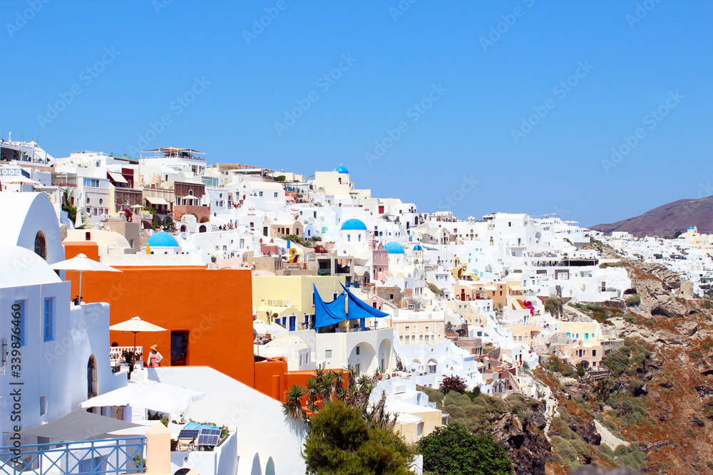 Wonderful Santorini view with white buildings and blue sky. Santorini view, Greece. Wonderful Santorini view with white buildings and blue sky. Santorini view, Greece.