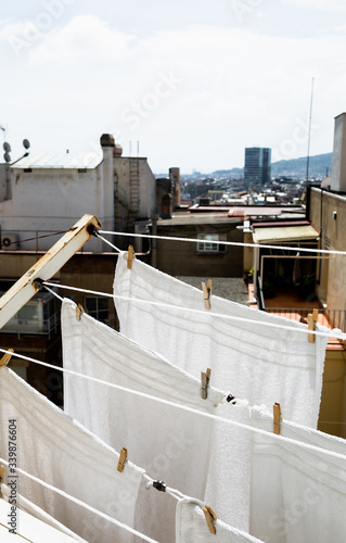 Photography White clothes drying on a clothesline during a sunny day.