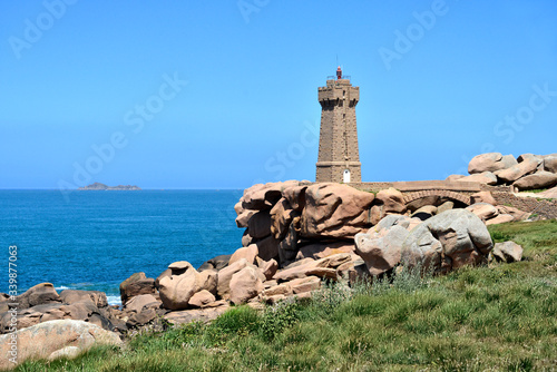 Mean Ruz lighthouse on the famous Pink Granite Coast (côte de granite rose in french) at Ploumanac'h, village in the commune of Perros-Guirec in France © Christian Musat