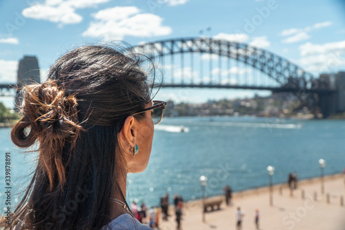 Canvas Print Woman at Iconic Sydney Harbor Bridge over river water
