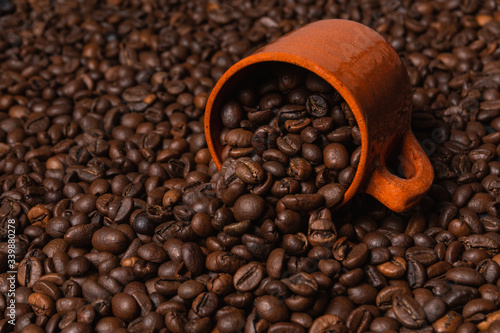 close up of coffee mug on coffee beans