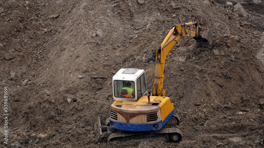 Tractors and excavators work on the construction of the foundation zero cycle Tractors and excavators work on the construction of the foundation zero cycle