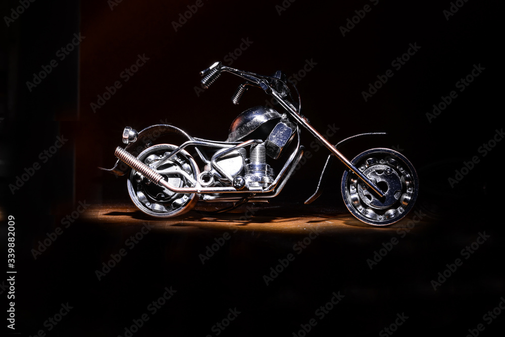 motorcycle on a black background under lighting