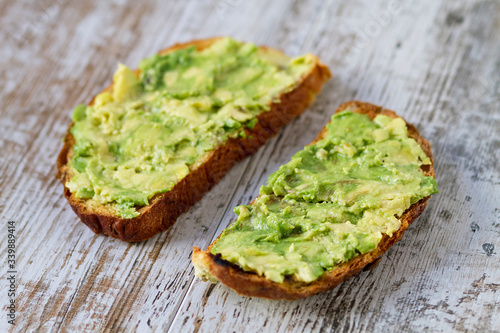 Mashed avocada and whole grain bread healthy toastes