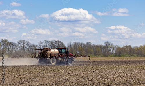 фотографія Spraying a Farm Field in Spring