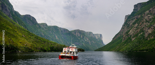 Panorama of boat tour on Western Brook Pond with steep cliff fjords at Gros Morne National Park Newfoundland photo