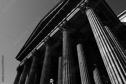 Marble columns and patterns on the building, a medium-sized photograph with a rhythm in the frame, a historic building in St. Petersburg. Photograph in black and white