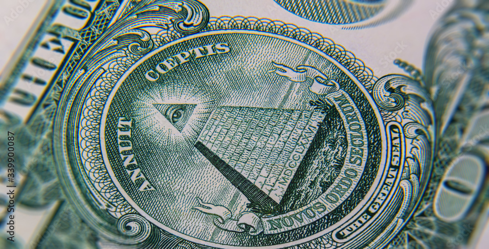 Extreme macro photography of a 1 US dollar banknote. Ultra close up of a one American dollar note. US dollar is the world currency.  The pyramid with the Eye of Providence on the reverse side of note