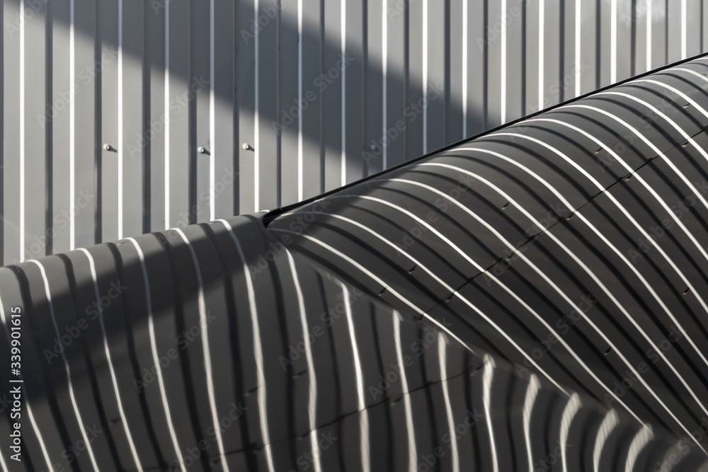 Striped metal texture and reflections on the window in gray tones Striped metal texture and reflections on the window in gray tones