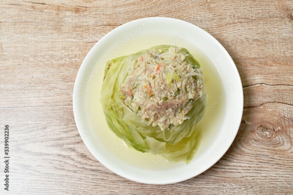 boiled cabbage stuffed minced pork with glass noodles in soup on plate
