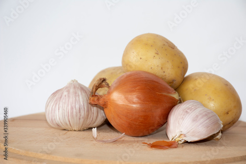 Vegetables on wooden board with white background
