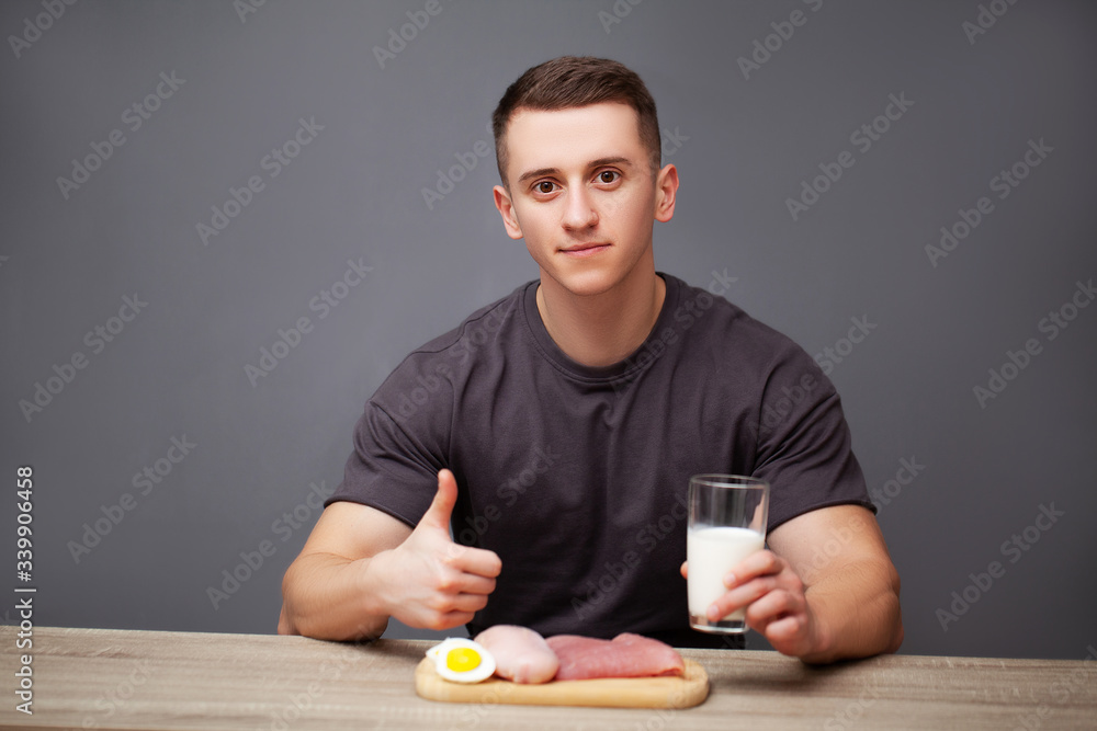 Man consumes a high-protein meal of meat and milk Man consumes a high-protein meal of meat and milk