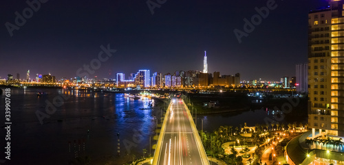 Top view aerial of a Ho Chi Minh City with development buildings, transportation, energy power infrastructure. View from Diamond island, District 2. Sai Gon, Vietnam