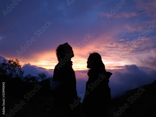 silhouette of couple on sunset