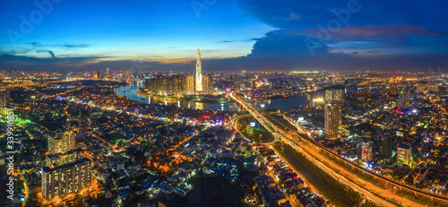 Top view aerial of center Ho Chi Minh City and Saigon bridge with development buildings, transportation, energy power infrastructure. Financial and business centers in Vietnam. View from District 2