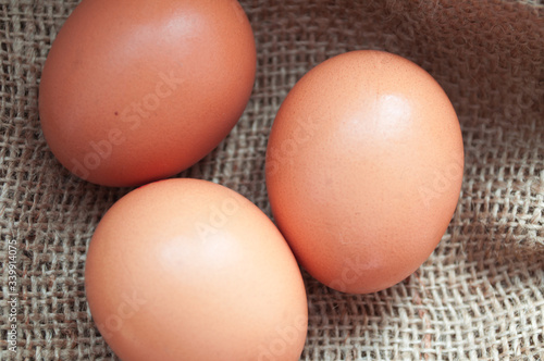 Chicken red eggs. Easter eggs. Symbols of the Christian holiday.
Farm eggs. Eco eggs.
