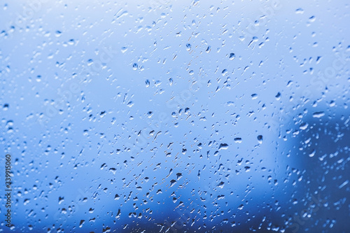 Drops of rain on the window. Water on the glass. Running drops. Background conceptual.