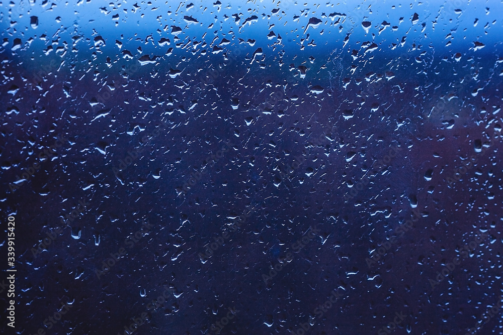 Drops of rain on the window. Water on the glass. Running drops. Background conceptual. Drops of rain on the window. Water on the glass. Running drops. Background conceptual.