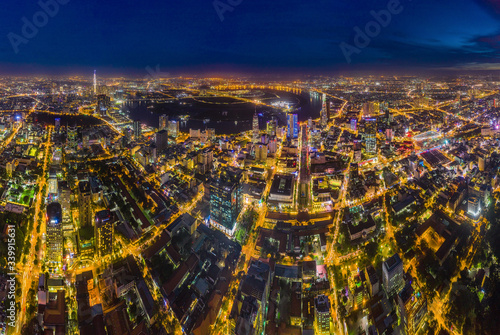 Top view aerial of Thu Thiem peninsula and center Ho Chi Minh City  with development buildings, transportation, energy power infrastructure. Financial and business centers in developed Vietnam © Hien Phung