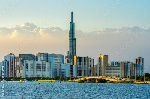 Top view aerial of center Ho Chi Minh City and Saigon bridge with development...