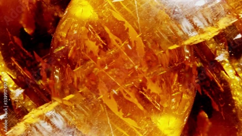 Amber. Beautiful colored pieces of amber. Amber texture. Red-yellow amber with bubbles, waves, divorces and color transitions. Natural mineral Sunstone. Material for jewelers. Crystal. photo