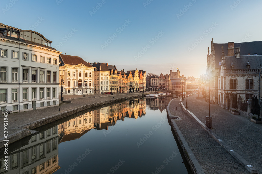 Gent, Belgium - April 9, 2020: View of the Graslei en Korenlei at sunrise, one of the most visited places in Ghent.