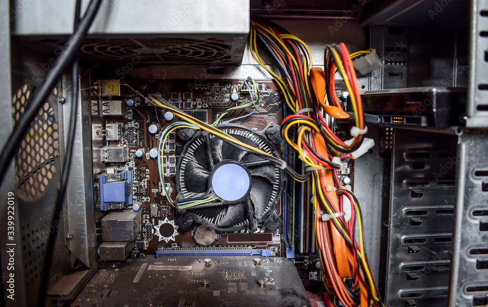 Foto de Computer power supply, motherboard and computer cooler close up