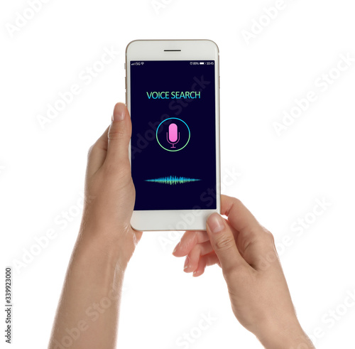 Woman using voice search on smartphone against white background, closeup