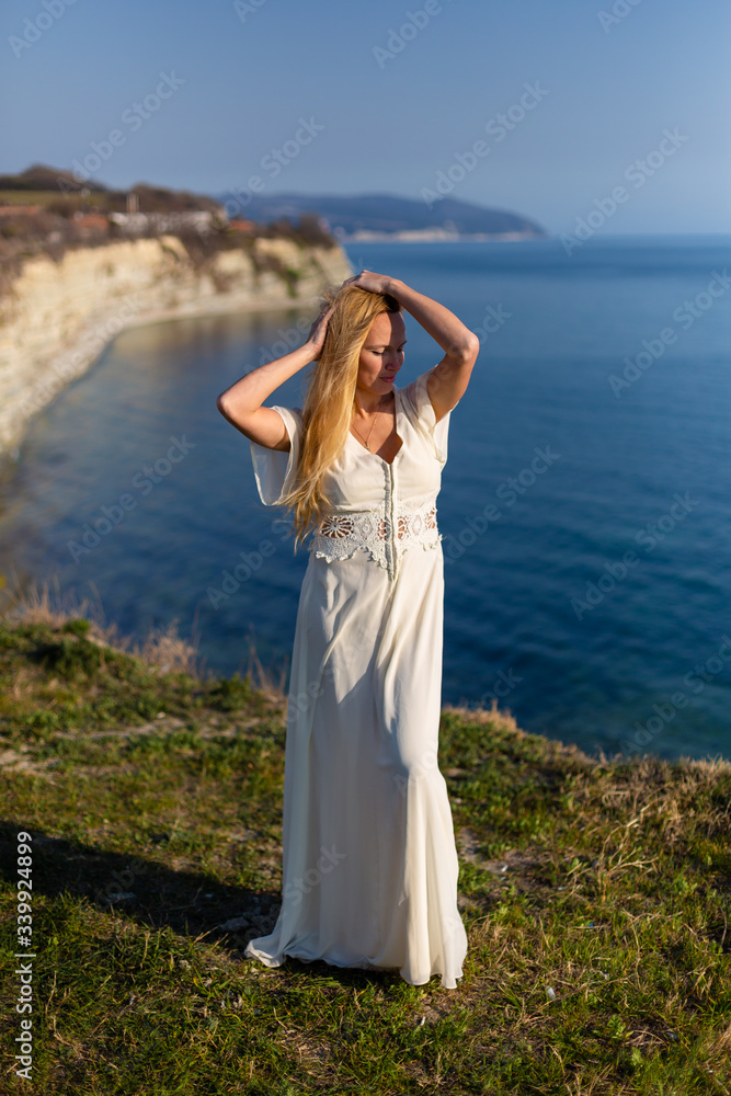 Blonde model at the sea at summer Blonde model at the sea at summer