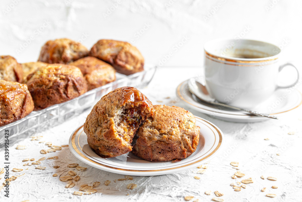 brown banana toffie muffins on a white background brown banana toffie muffins on a white background