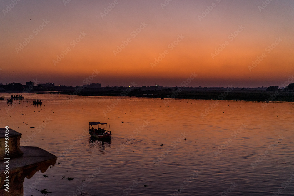 Boats on river in India during sunset Boats on river in India during sunset