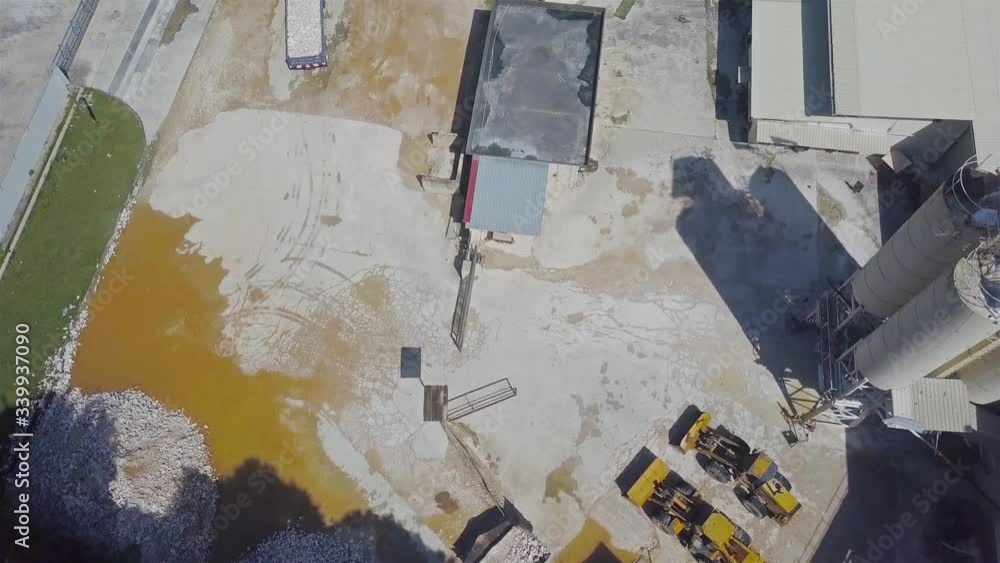 Lorry With Load Driving at The Construction site in Ipoh Top View - Dolly Forward Lorry With Load Driving at The Construction site in Ipoh Top View - Dolly Forward