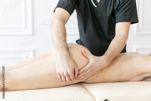 young woman receiving a leg massage