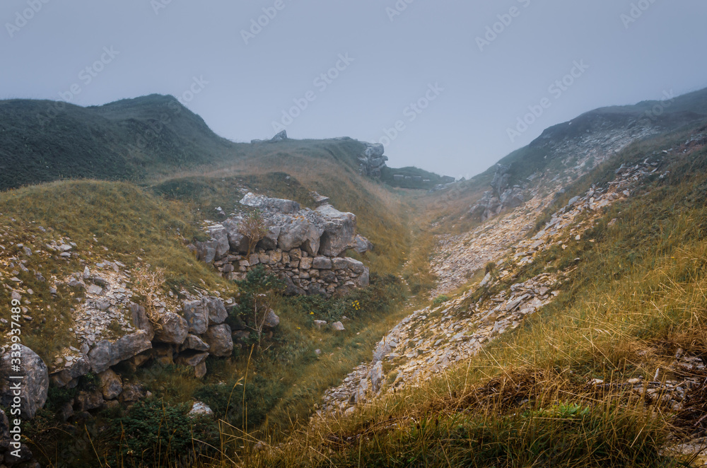 Atmospheric view overlooking a deserted Tout Quarry sculpture park and nature reserve on a foggy summer afternoon, Isle of Portland, Dorest, UK
