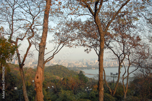 West Lake (Xi Hu) in Hangzhou, Zhejiang Province, China. View from Baoshi Hill across West Lake to Hangzhou city. West Lake is a major UNESCO tourist attraction in Hangzhou, China.