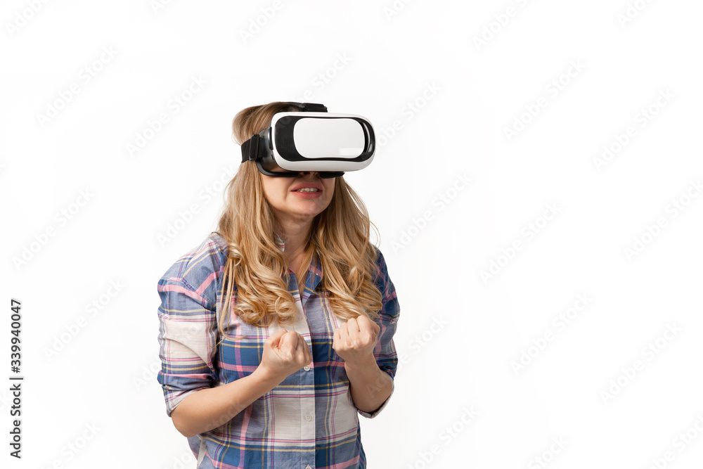Young caucasian woman using VR-headset devices, gadgets isolated on white studio background. Concept of modern technologies, gadgets, tech, emotions, ad. Copyspace. Gaming, meeting online education. Young caucasian woman using VR-headset devices, gadgets isolated on white studio background. Concept of modern technologies, gadgets, tech, emotions, ad. Copyspace. Gaming, meeting online education.