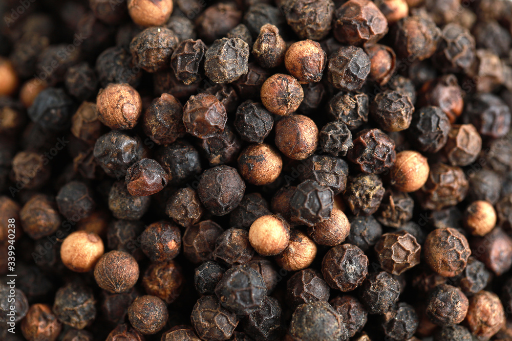 Top view pile of black peppercorns isolated on white Top view pile of black peppercorns isolated on white