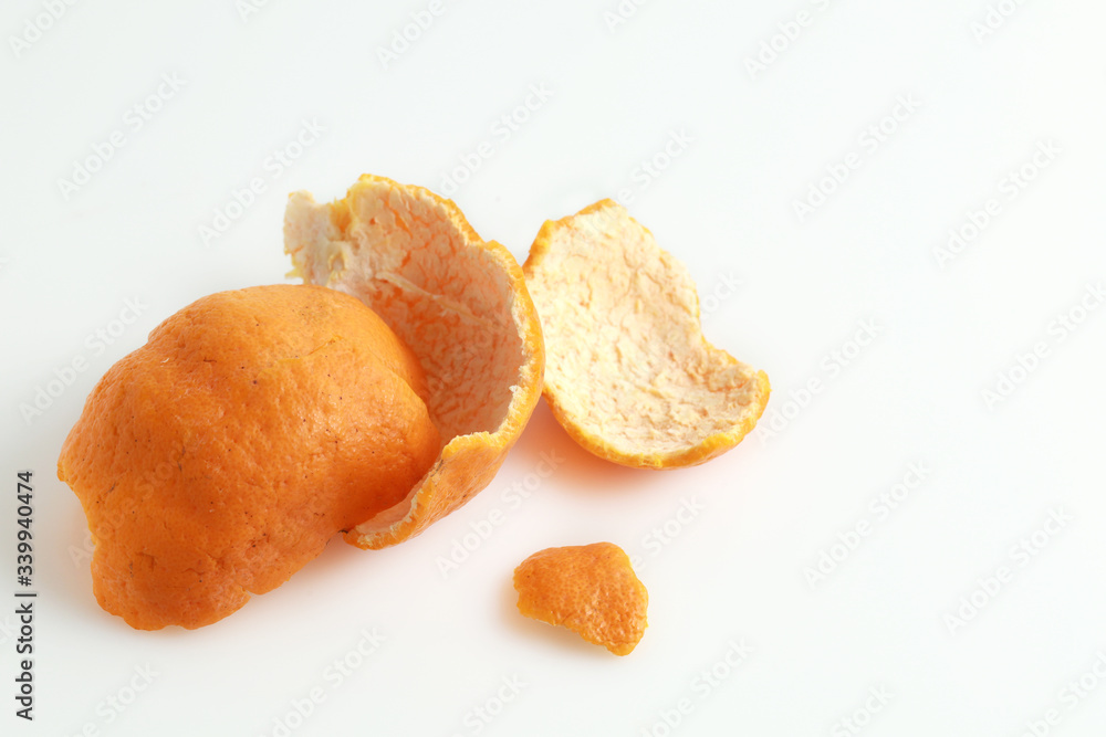 Peeled tangerine or mandarin fruit isolated on white background Peeled tangerine or mandarin fruit isolated on white background