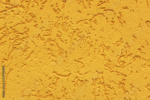 orange cement wall, building facade as a color relief texture close-up, copy space